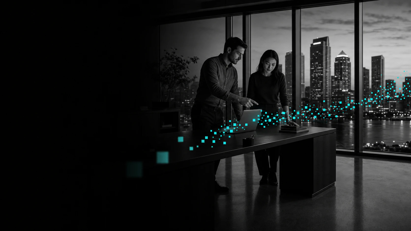 Two enterprise operators work over a laptop as cyan data moves from their desk through the glass toward downtown Tampa.